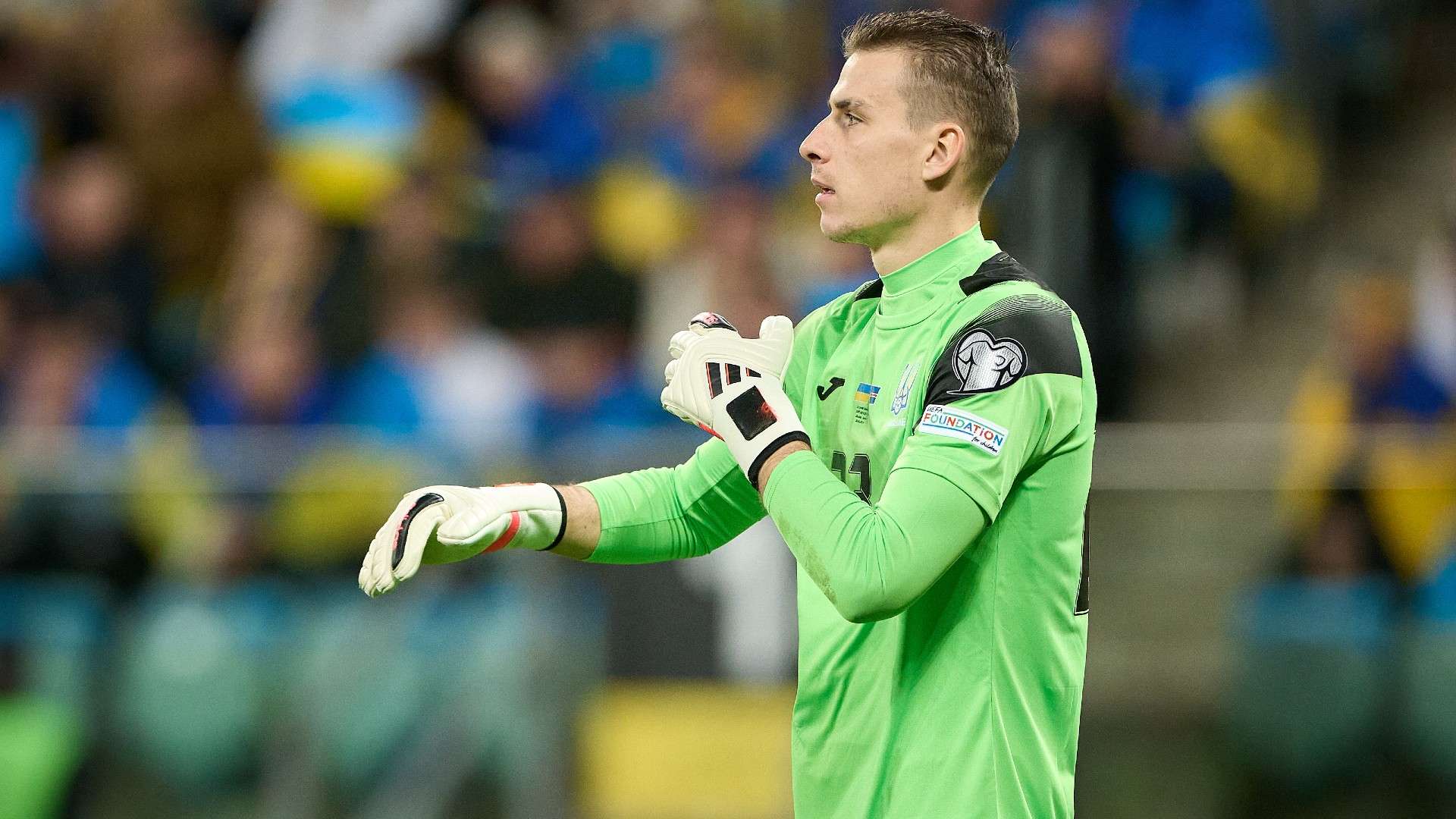 Andriy Lunin of Ukraine looks